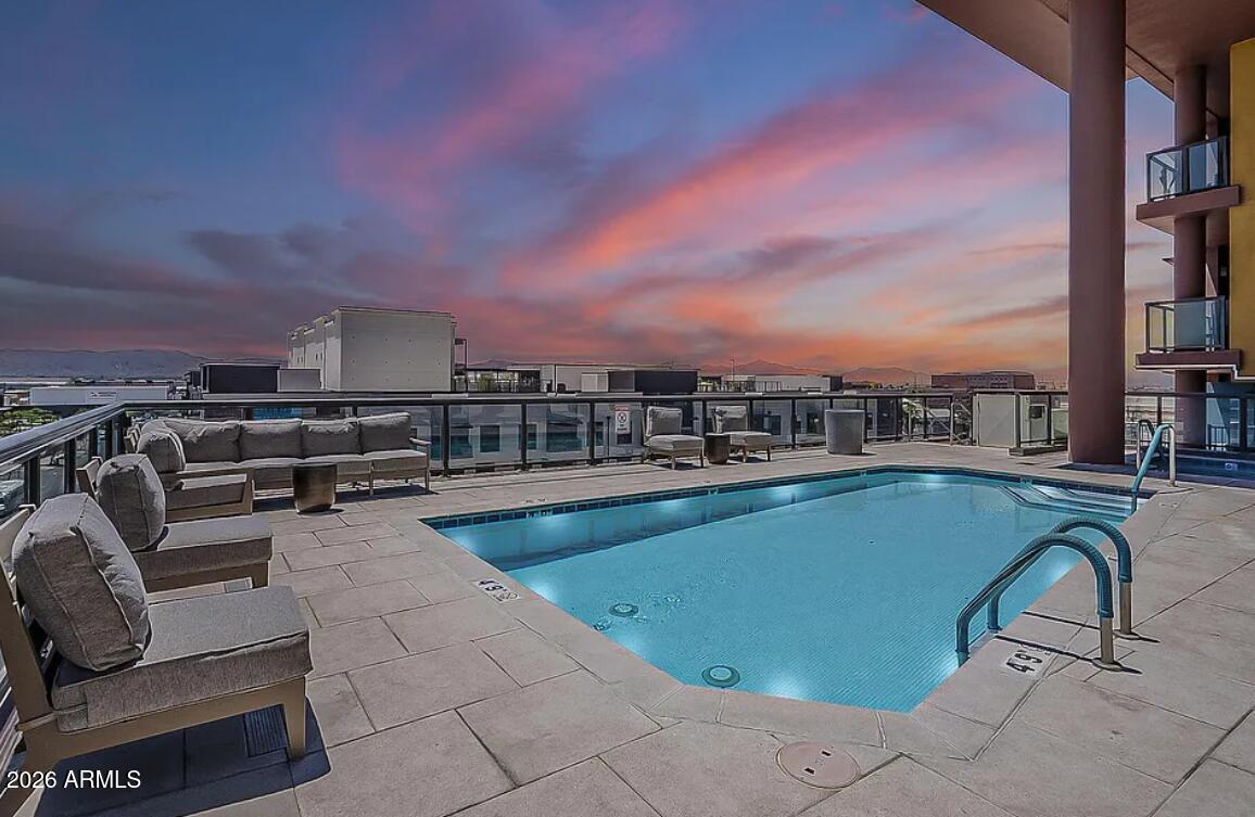 310 South 4th Street, Unit 1109 Phoenix, AZ 85004 - Photo 25 of 36 a view of a swimming pool with seating space