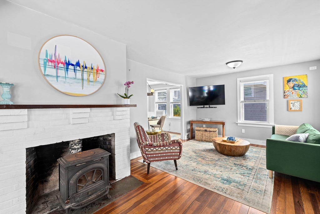 69 Kenneth Road Scituate, MA 02066 - Photo 3 of 36 a living room with furniture and a fireplace