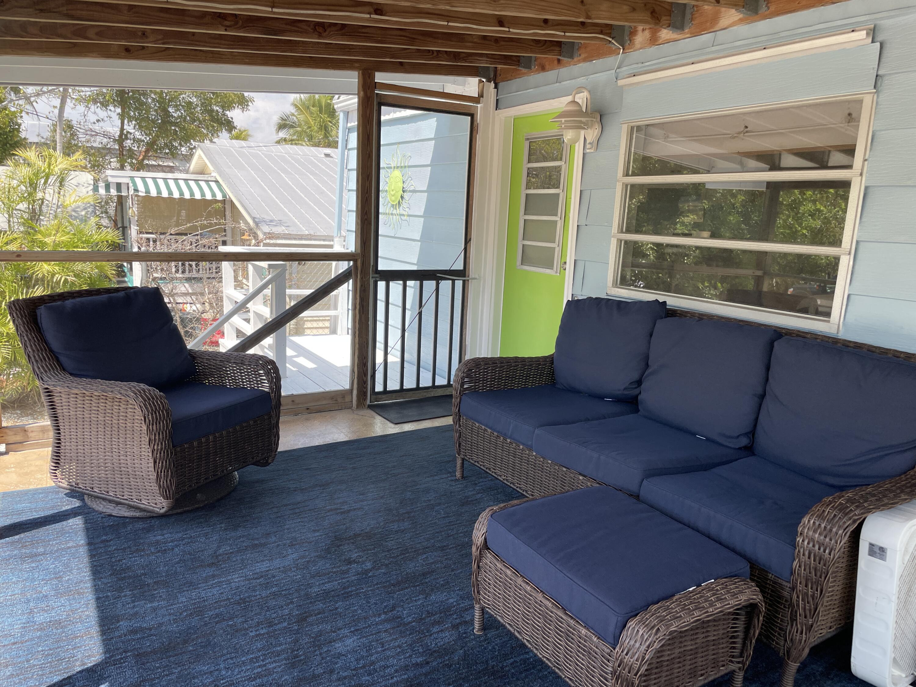 27853 Coral Shores Road Summerland Key, FL 33042 - Photo 11 of 47 a living room with furniture and a window