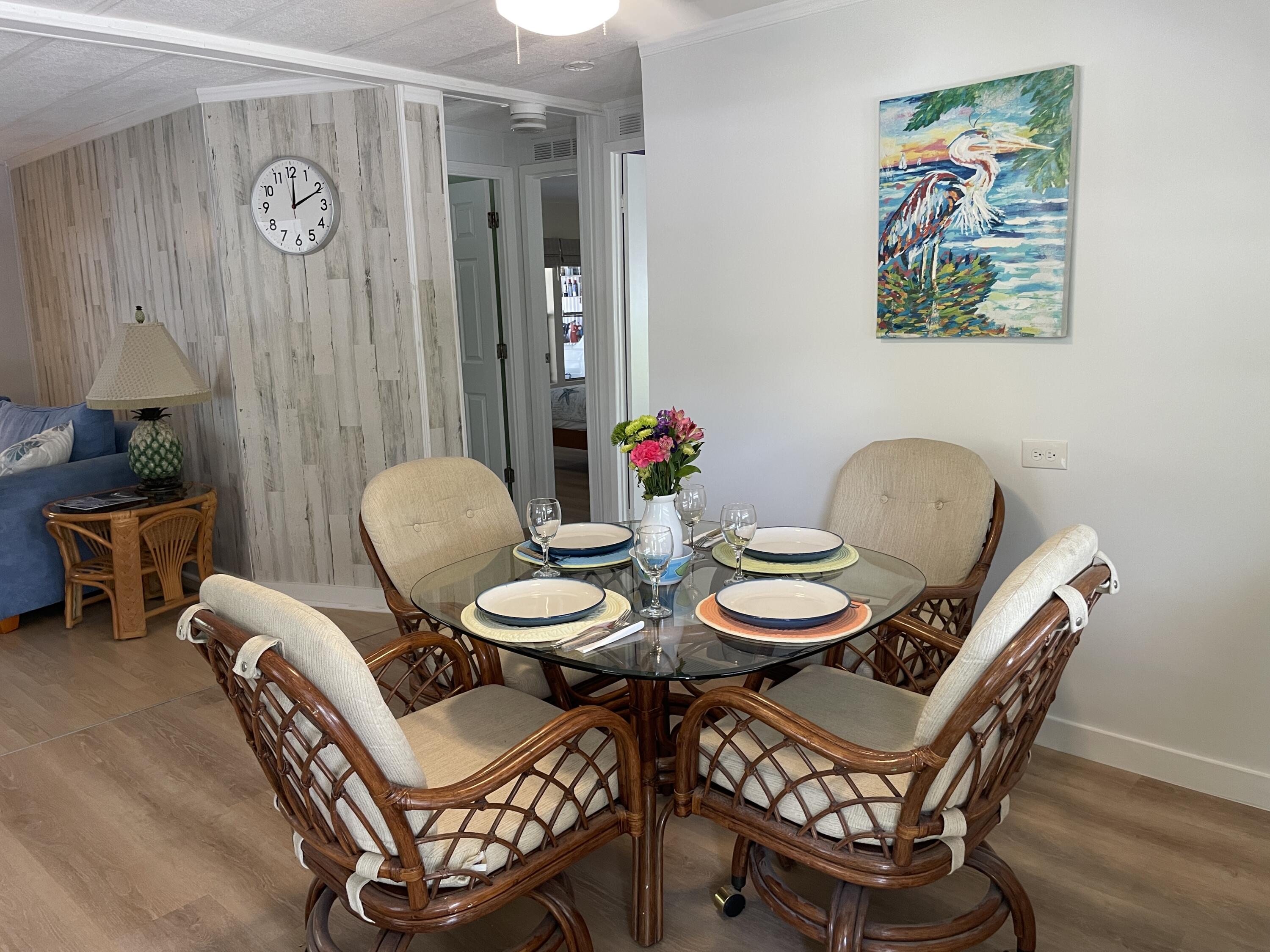 27853 Coral Shores Road Summerland Key, FL 33042 - Photo 14 of 47 a view of a dining room with furniture wooden floor and a potted plant