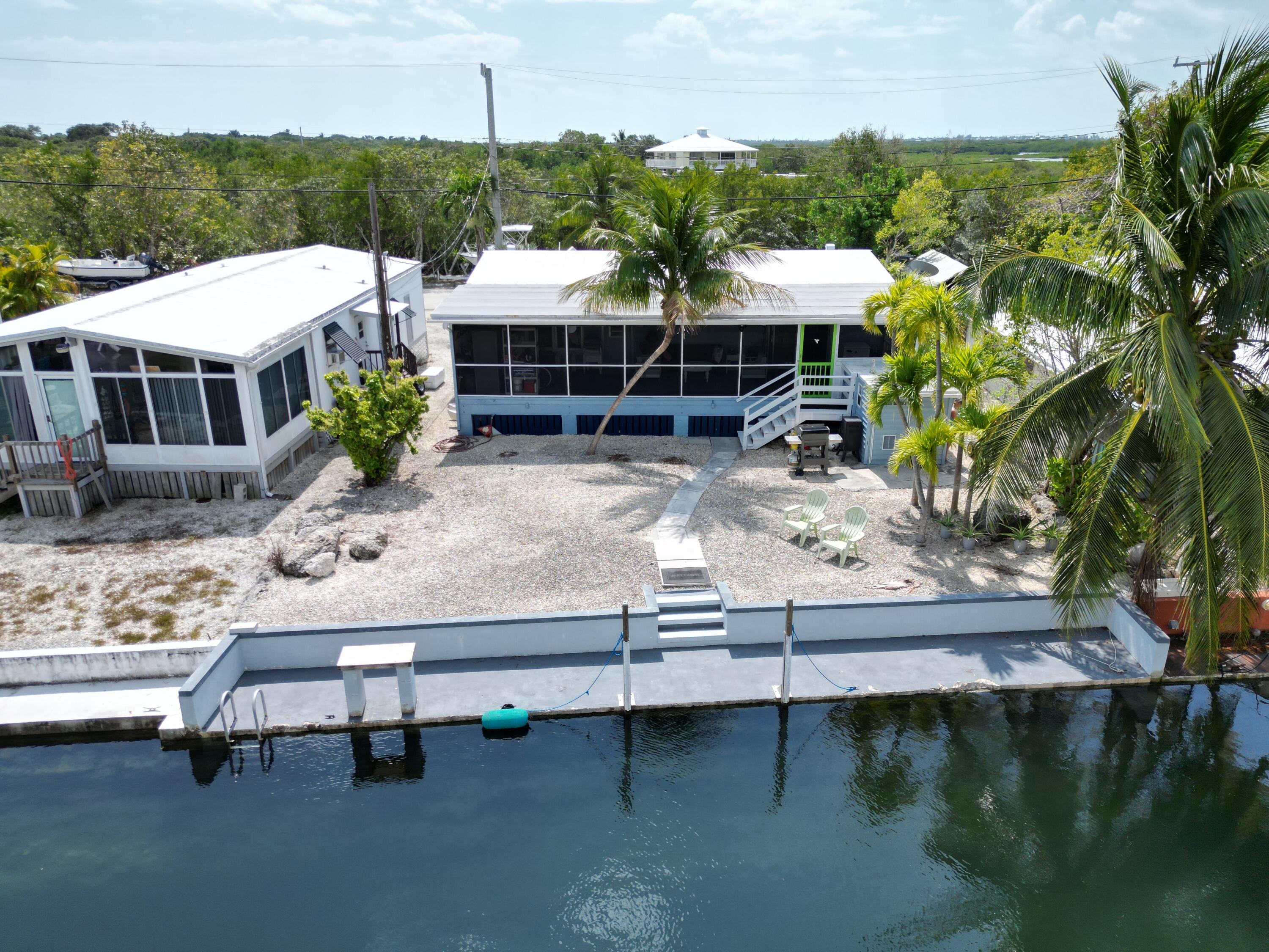 27853 Coral Shores Road Summerland Key, FL 33042 - Photo 2 of 47 a view of a house with yard and sitting area