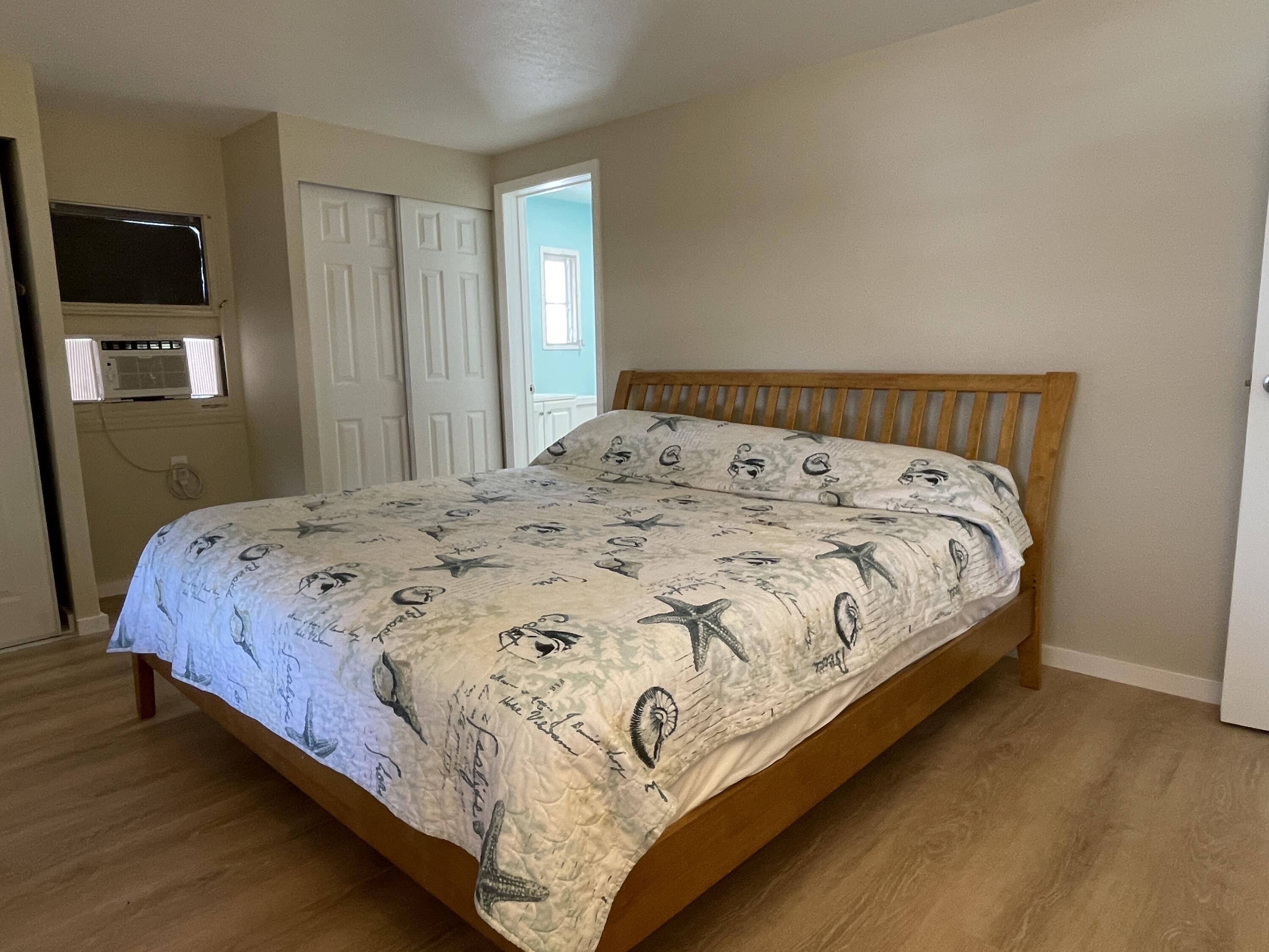 27853 Coral Shores Road Summerland Key, FL 33042 - Photo 22 of 47 a bedroom with a bed and flat screen tv
