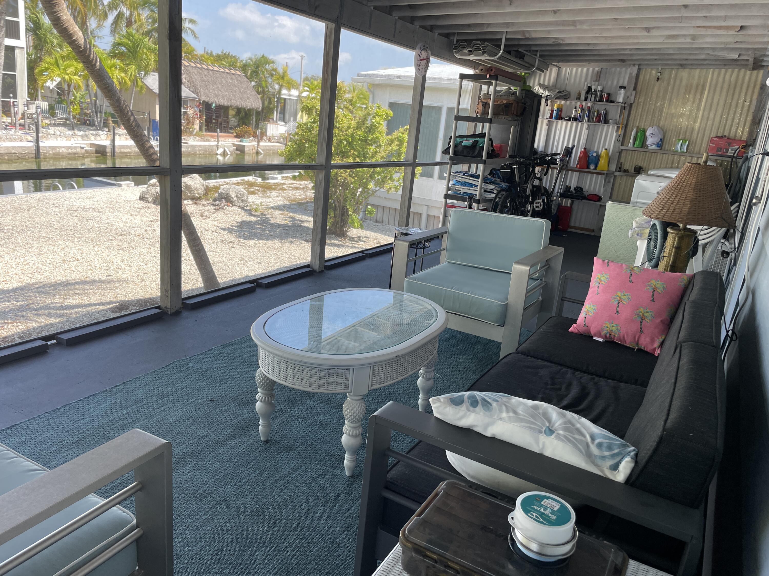 27853 Coral Shores Road Summerland Key, FL 33042 - Photo 32 of 47 a living room with furniture and a window