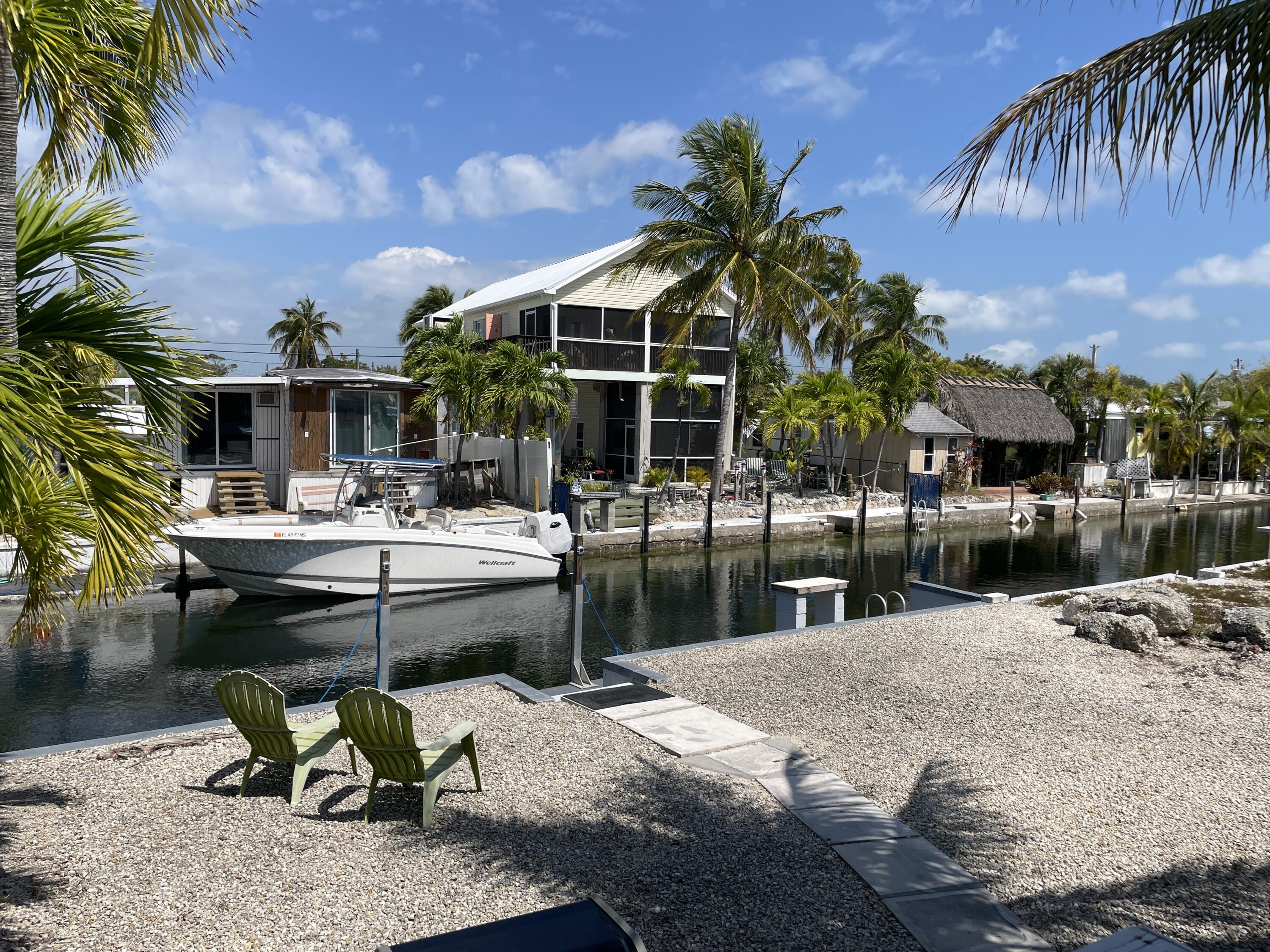 27853 Coral Shores Road Summerland Key, FL 33042 - Photo 34 of 47 a swimming pool with outdoor seating and yard