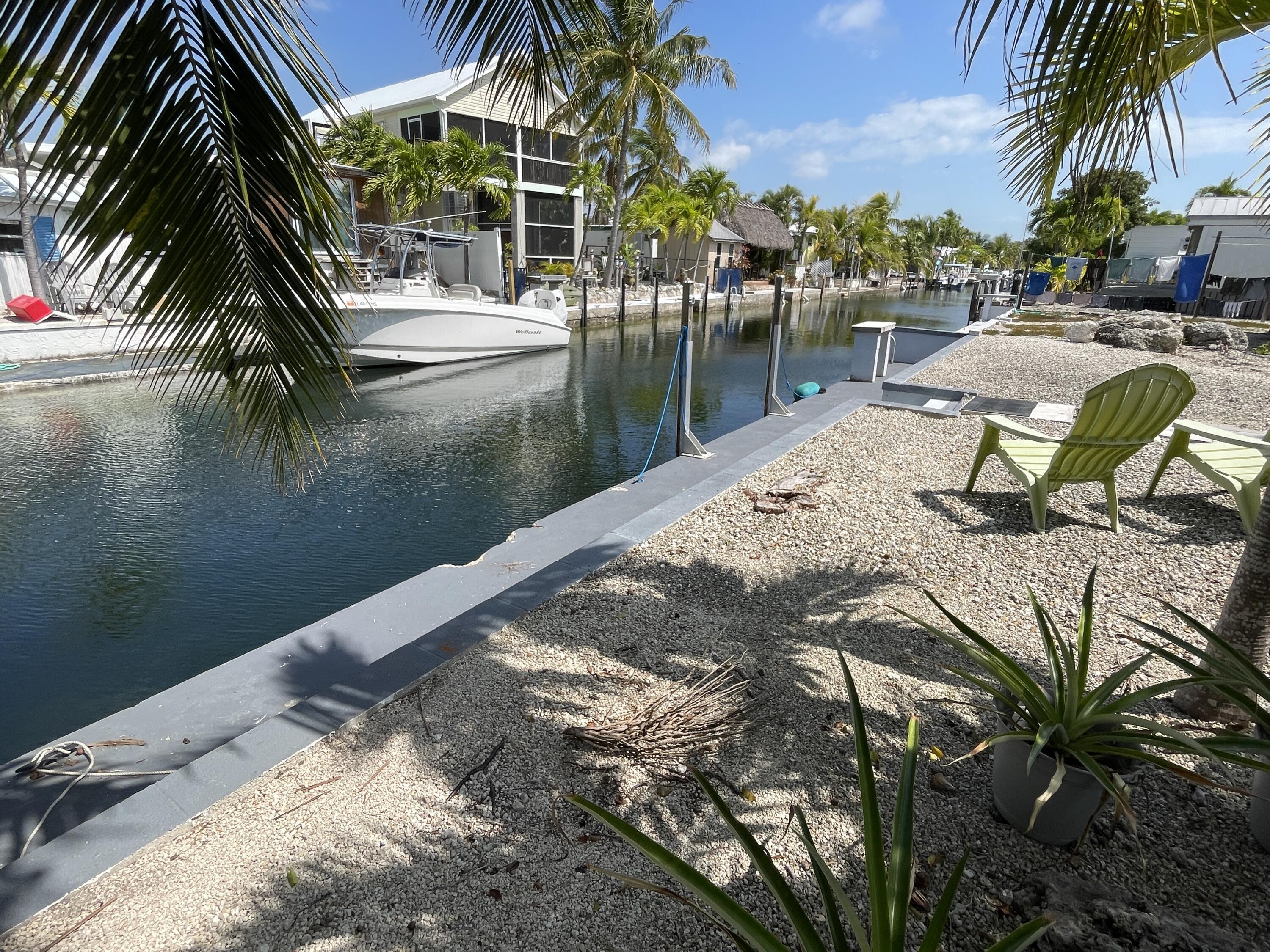 27853 Coral Shores Road Summerland Key, FL 33042 - Photo 35 of 47 a view of swimming pool with a table and chairs