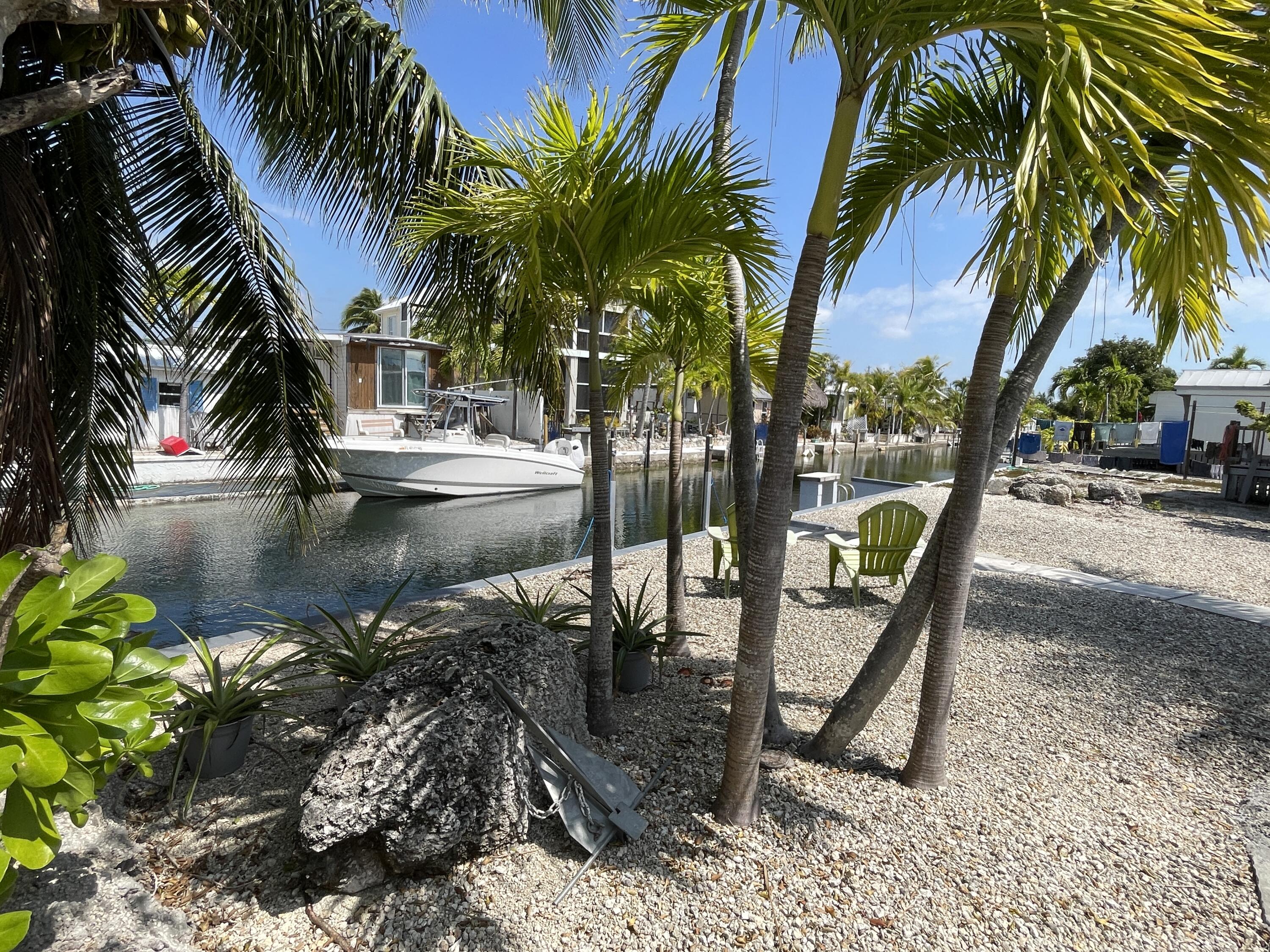 27853 Coral Shores Road Summerland Key, FL 33042 - Photo 36 of 47 a view of swimming pool with a garden and patio