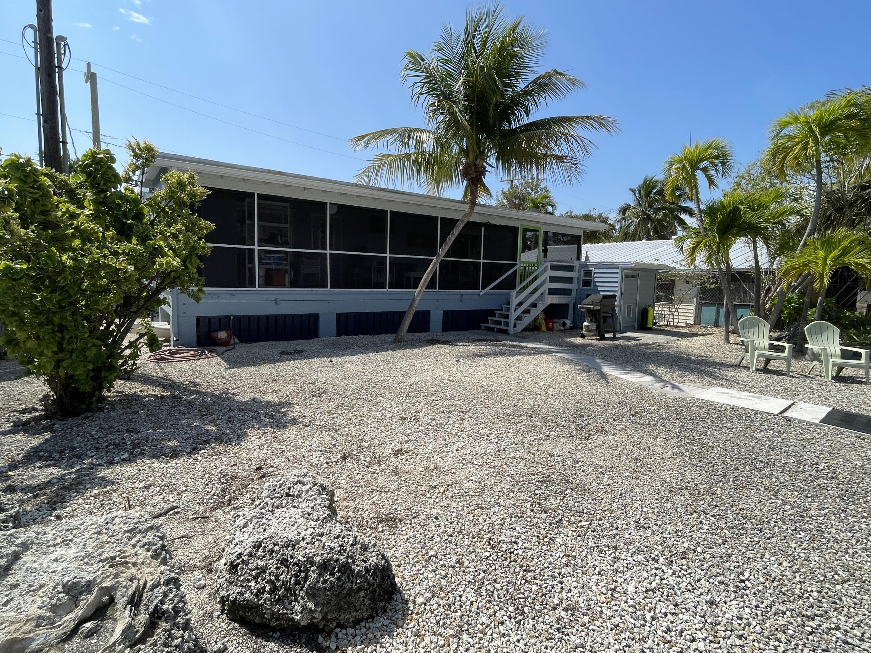27853 Coral Shores Road Summerland Key, FL 33042 - Photo 37 of 47 a view of a house with a yard and sitting area
