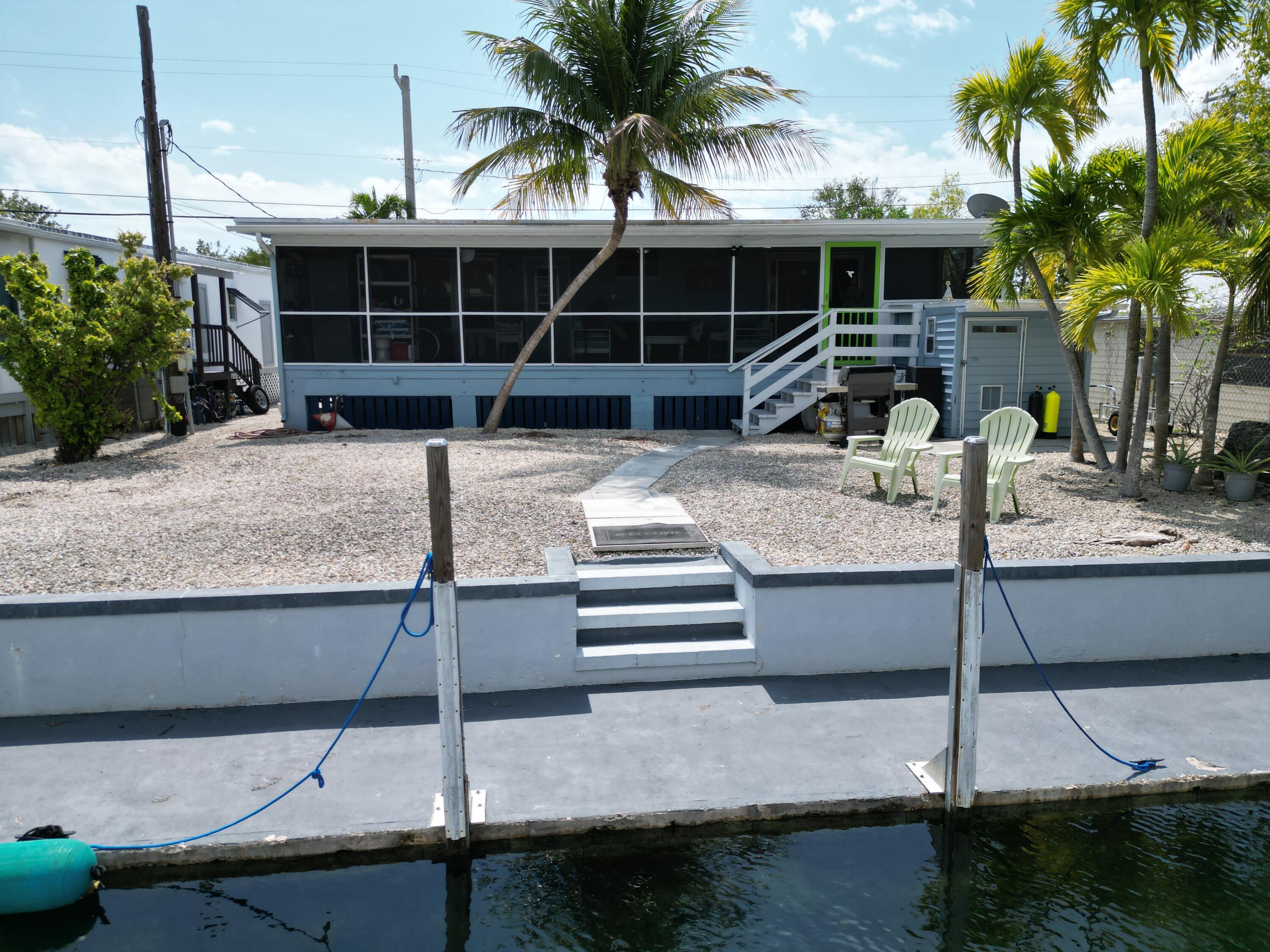 27853 Coral Shores Road Summerland Key, FL 33042 - Photo 39 of 47 a front view of a house with garden