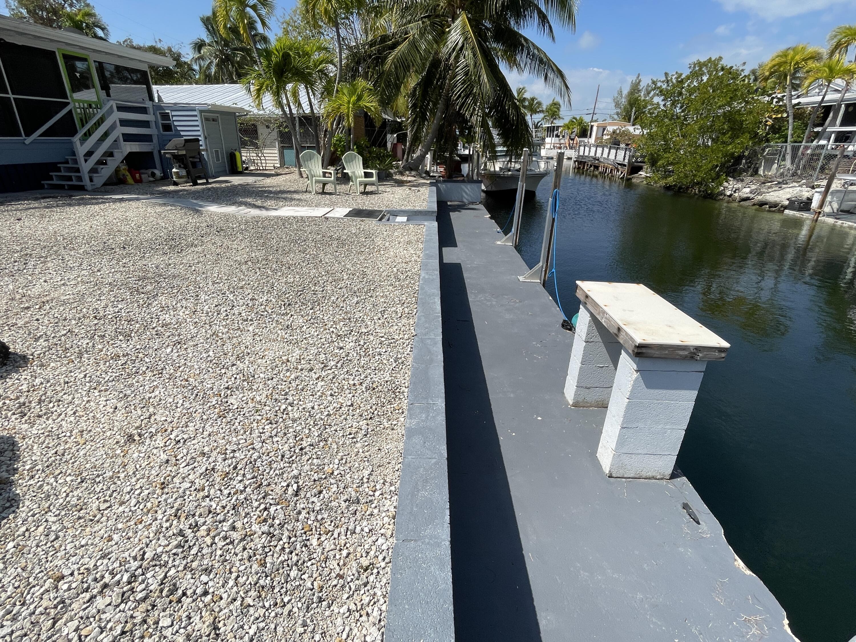 27853 Coral Shores Road Summerland Key, FL 33042 - Photo 40 of 47 a view of a lake with outdoor seating