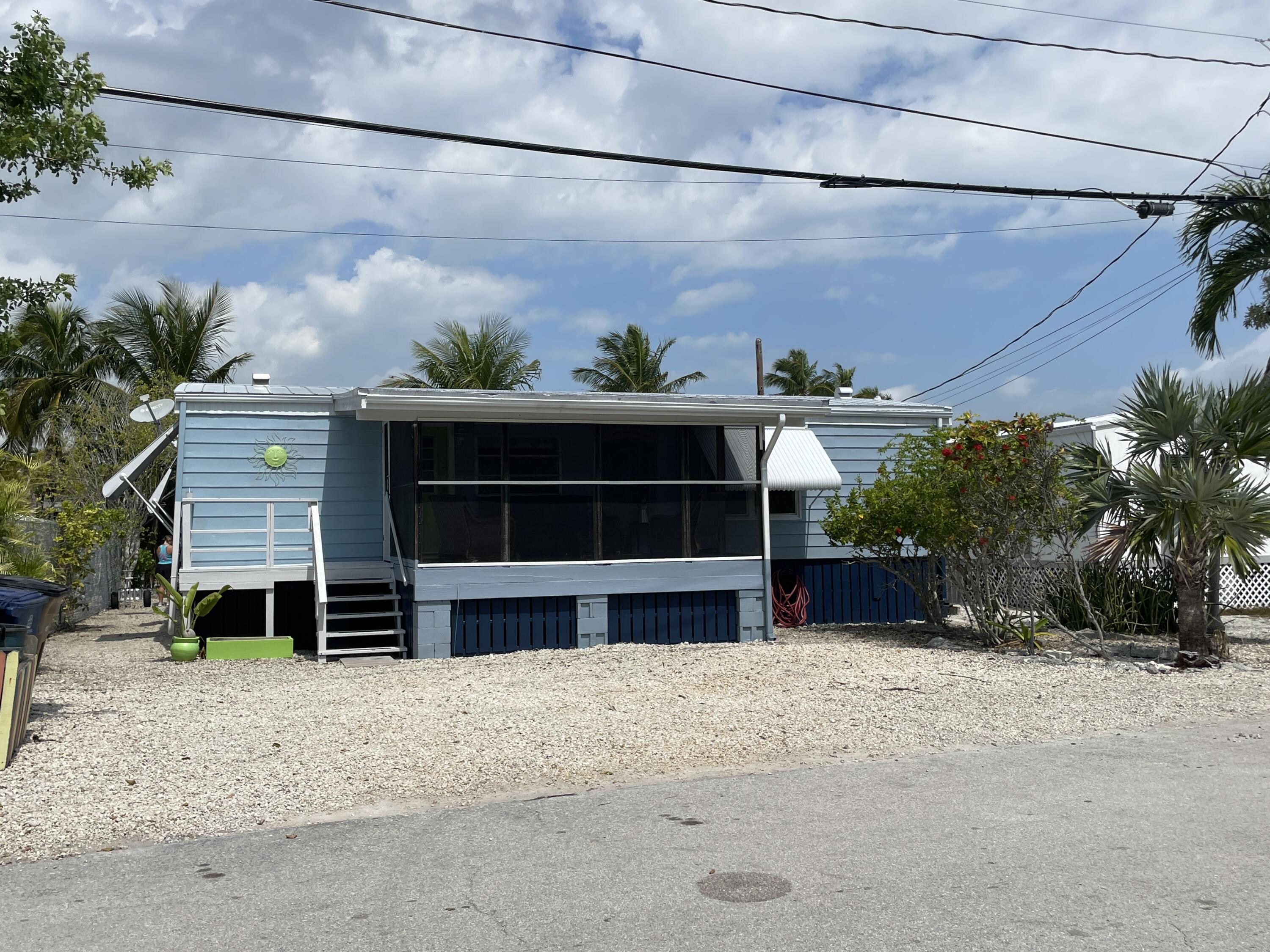 27853 Coral Shores Road Summerland Key, FL 33042 - Photo 7 of 47 a view of a house with a yard