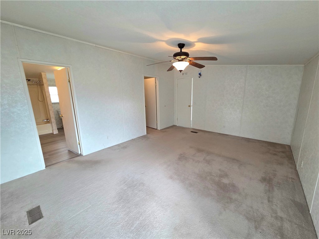 3290 Medicine Man Road Pahrump, NV 89048 - Photo 14 of 27 Unfurnished room with carpet and ceiling fan