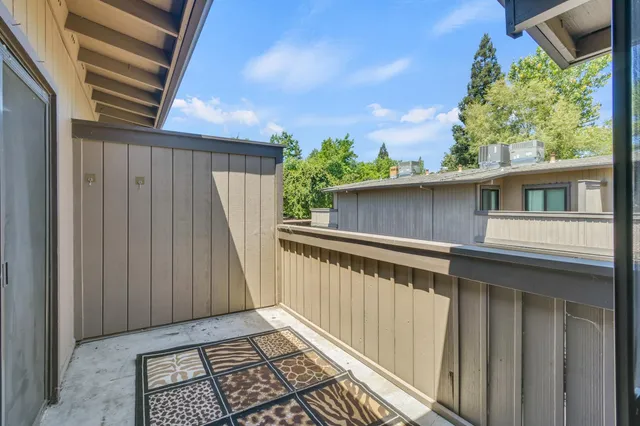 a balcony view with a garden
