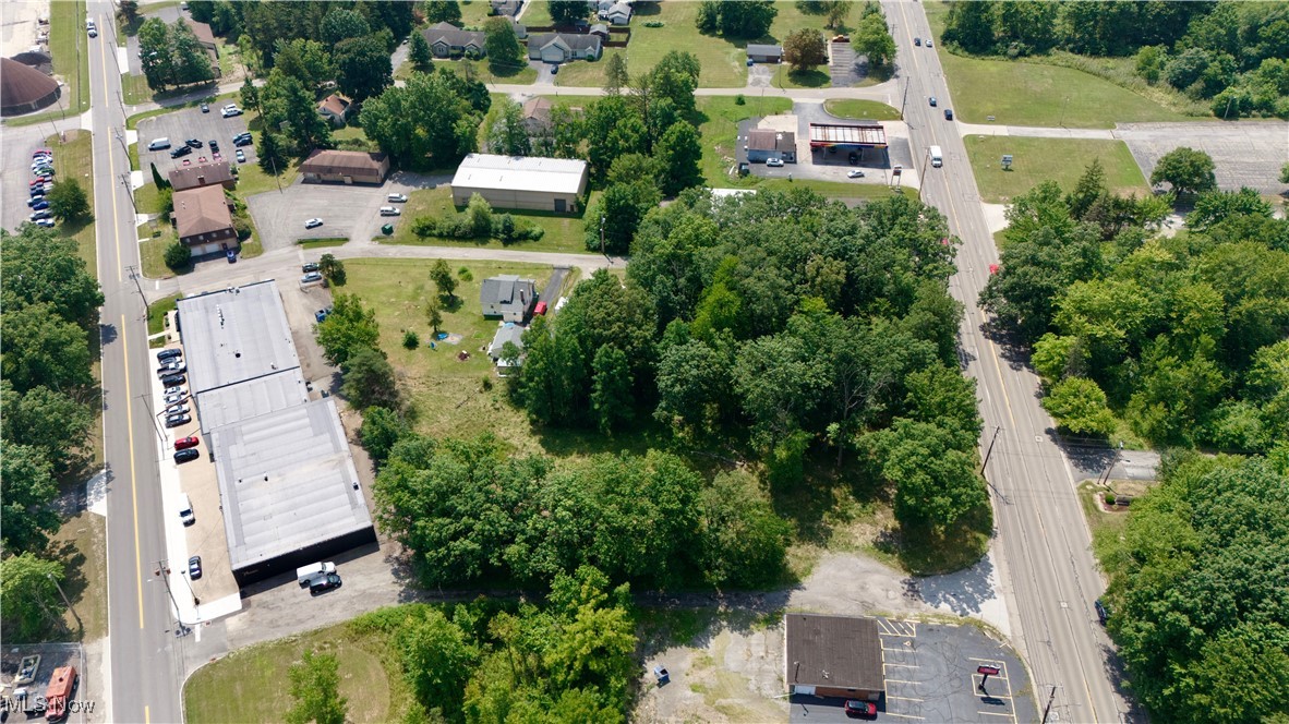 653 South Meridian Road Youngstown, OH 44509 - Photo 4 of 4 Aerial view of property and surrounding area featuring a tree filled landscape