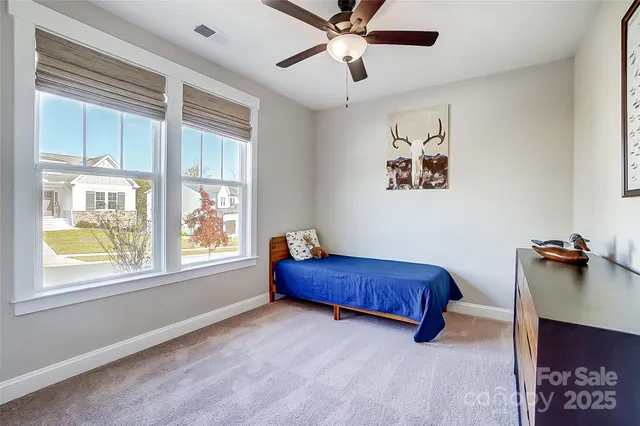 a bedroom with furniture and a window