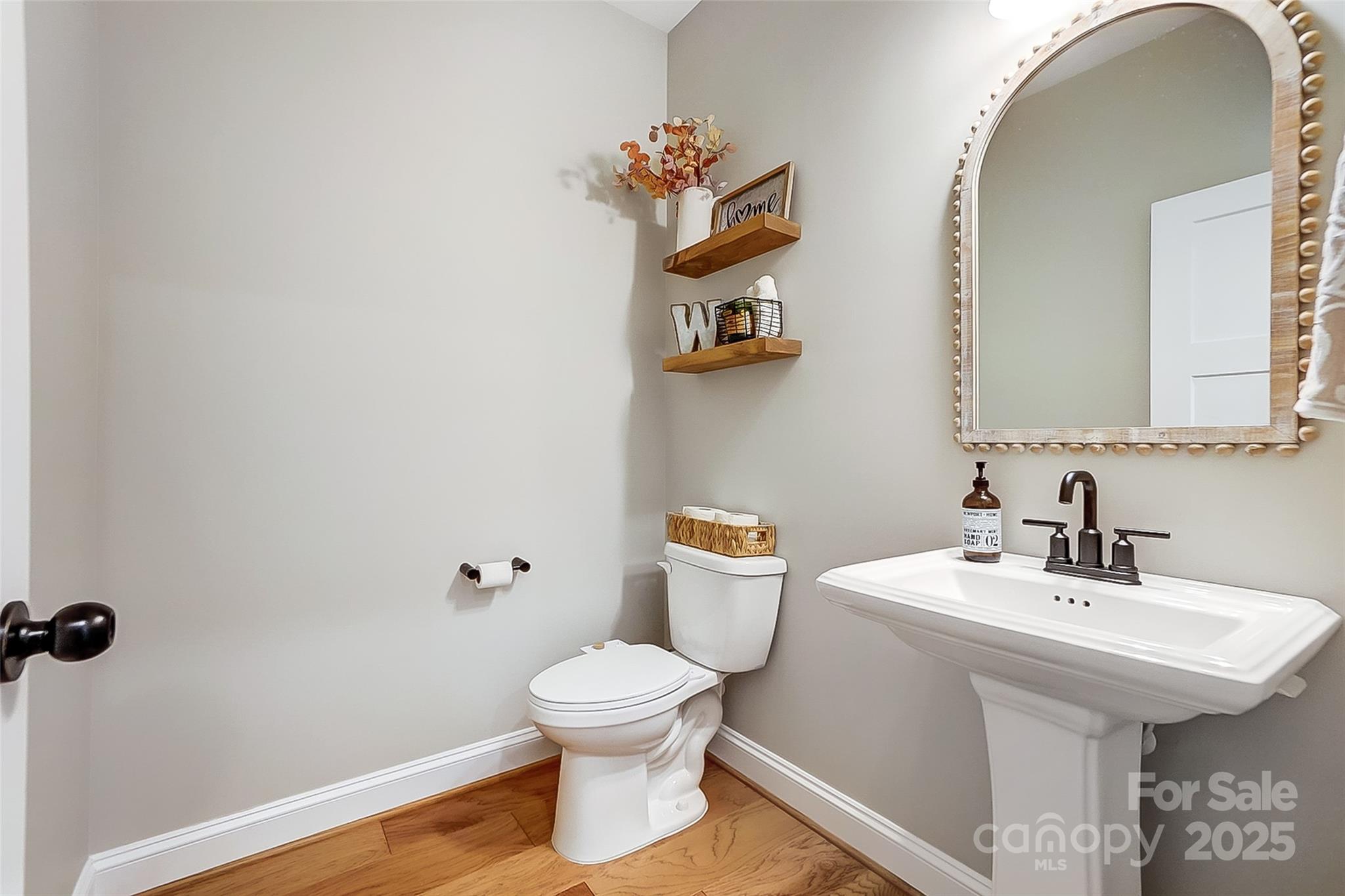 4116 Spring Cove Way Belmont, NC 28012 - Photo 29 of 44 a bathroom with a sink toilet and a mirror
