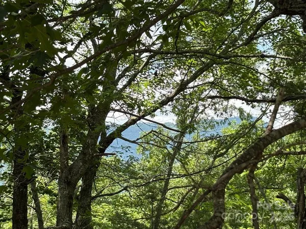 a view of outdoor space with playground and green space