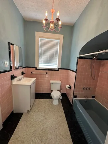a bathroom with a sink a toilet and a bathtub