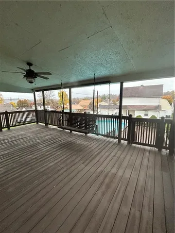 a view of a balcony with wooden floor