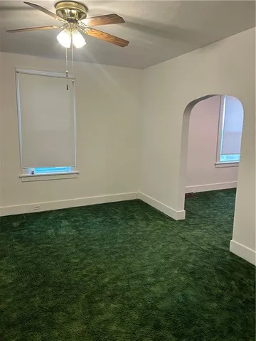 a view of a room with a large window