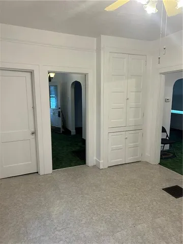 a view of an empty room with a bathroom