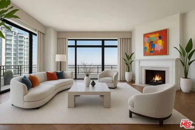 a living room with furniture large window and a fireplace