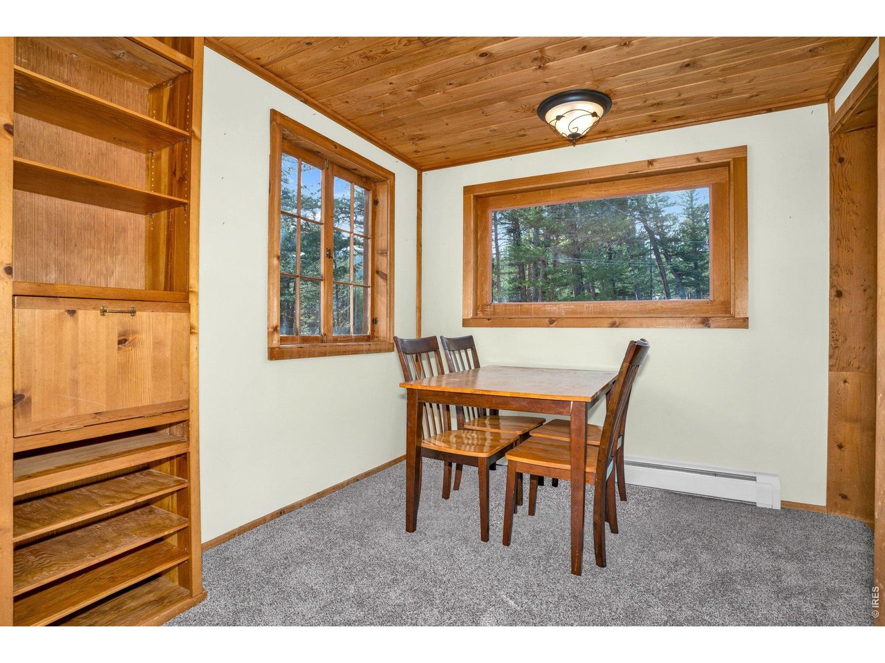 251 Haugen Slide Road Allenspark, CO 80510 - Photo 12 of 42 a dining room with furniture and a window