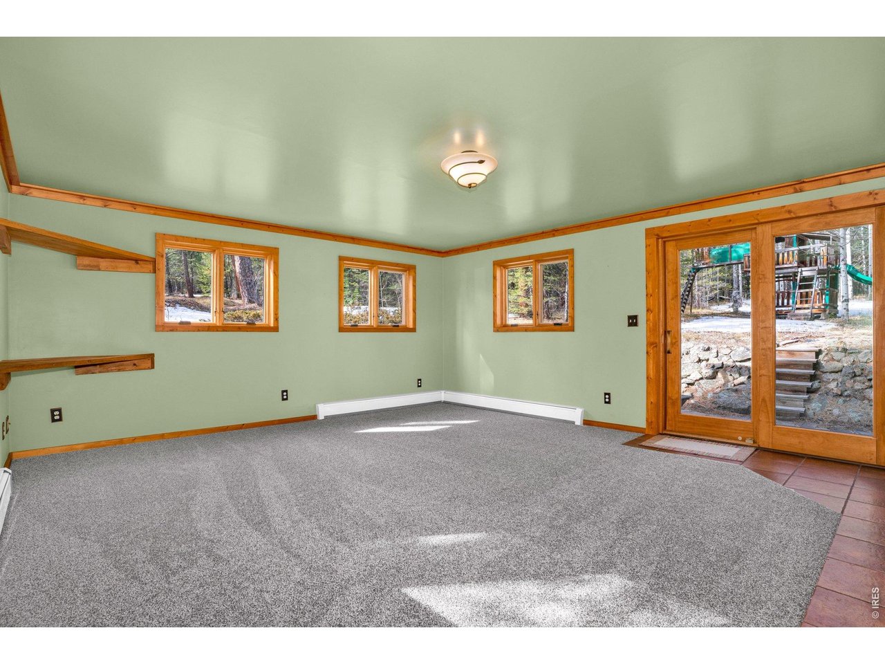 251 Haugen Slide Road Allenspark, CO 80510 - Photo 17 of 42 a view of an empty room with a window