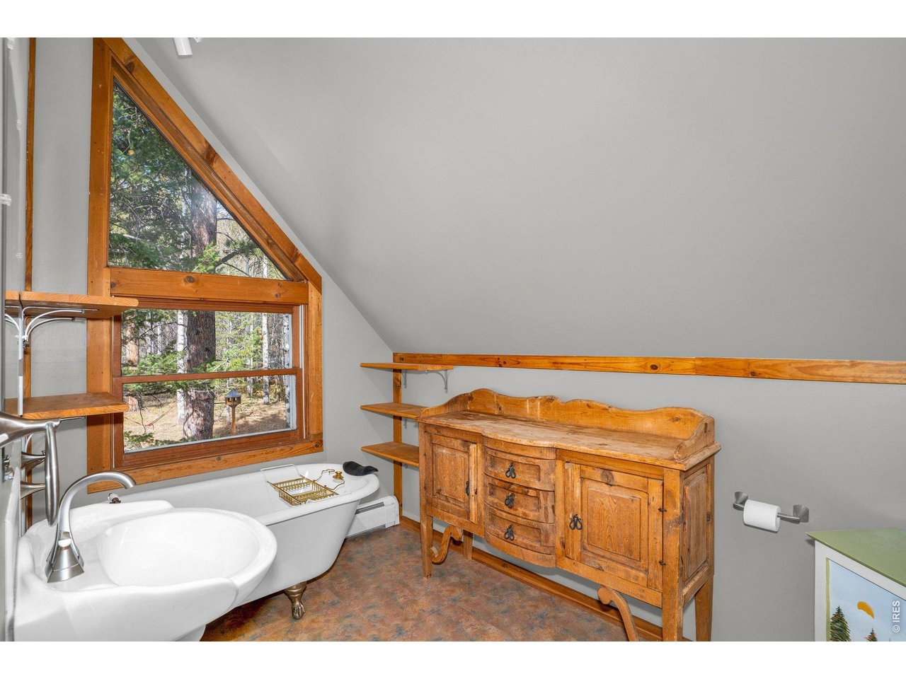 251 Haugen Slide Road Allenspark, CO 80510 - Photo 21 of 42 a living room with furniture a rug and a large window