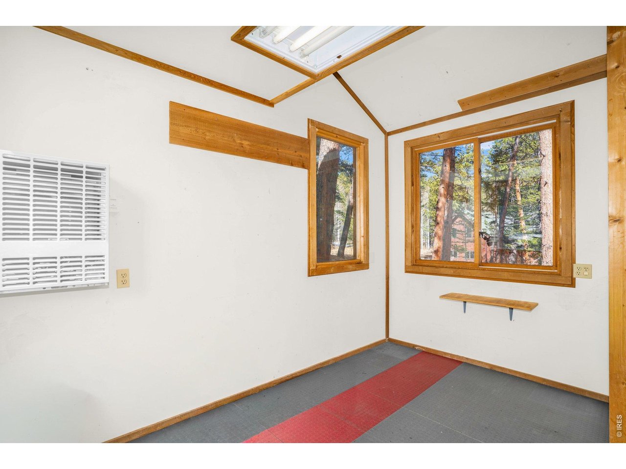 251 Haugen Slide Road Allenspark, CO 80510 - Photo 31 of 42 a view of an empty room with a window