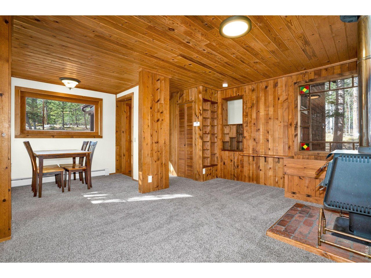 251 Haugen Slide Road Allenspark, CO 80510 - Photo 7 of 42 a view of a livingroom with furniture and window