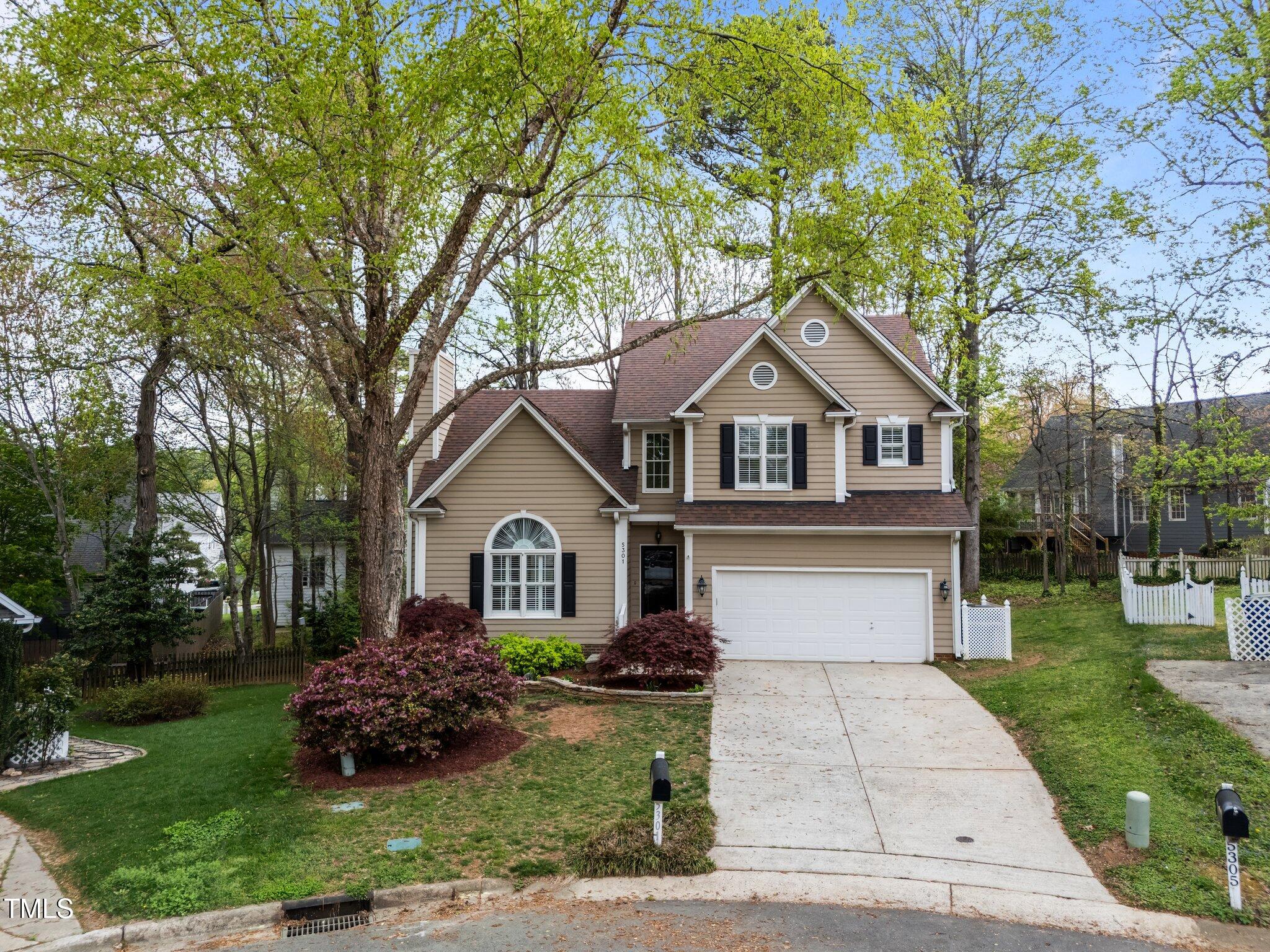 5301 Tilford Lane Raleigh, NC 27613 - Photo 5 of 42 a front view of a house with a garden