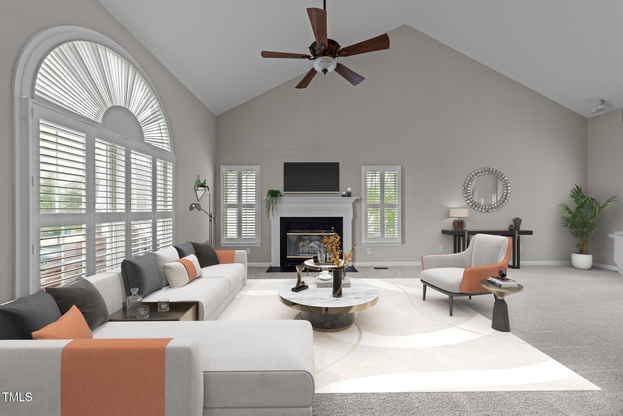 5301 Tilford Lane Raleigh, NC 27613 - Photo 7 of 42 a living room with furniture chandelier and a fireplace