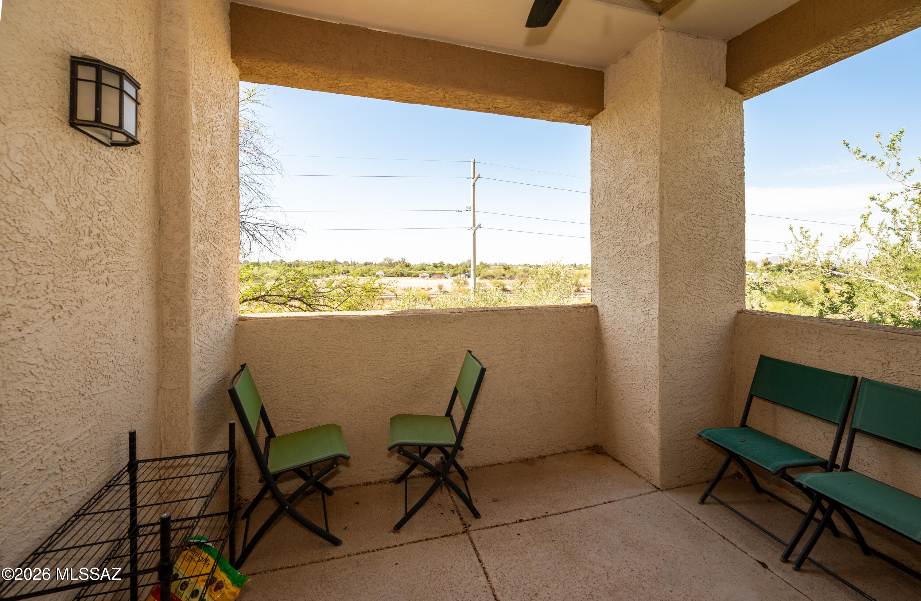 2550 East River Road, Unit 15303 Tucson, AZ 85718 - Photo 13 of 15 a view of a dining room with furniture and a window