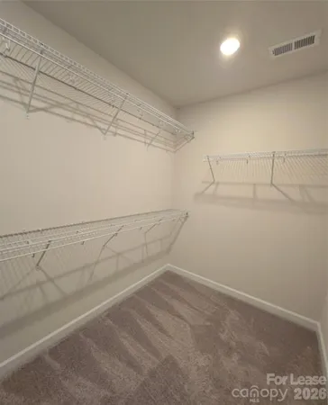 a view of a room with racks on the wall