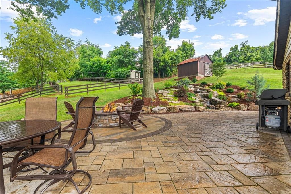 249 Fulton Road Canonsburg, PA 15317 - Photo 25 of 25 a view of a patio with a dining table and chairs