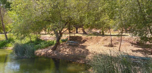 a view of a backyard with sitting area