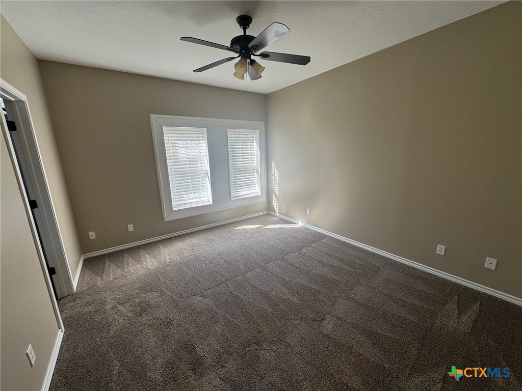 2776 South Highway 77 Cameron, TX 76520 - Photo 20 of 30 a view of a livingroom with a ceiling fan and window