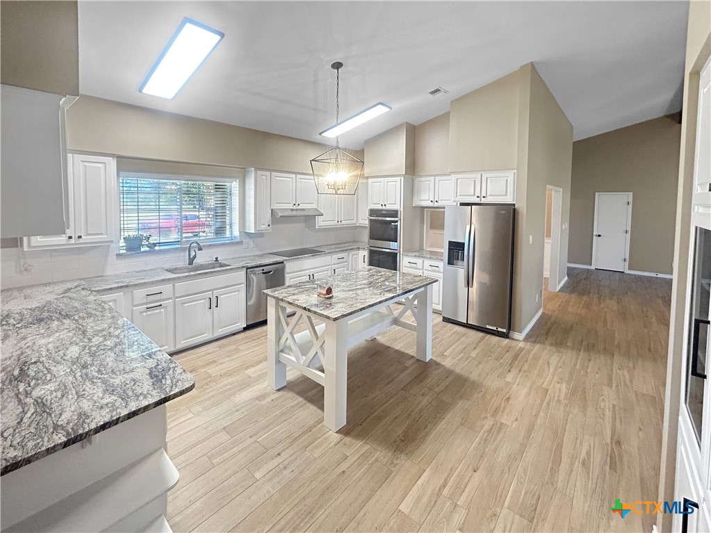 2776 South Highway 77 Cameron, TX 76520 - Photo 7 of 30 a kitchen with a sink appliances and cabinets