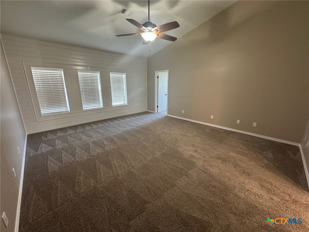 2776 South Highway 77 Cameron, TX 76520 - Photo 9 of 30 en empty room with windows and fan