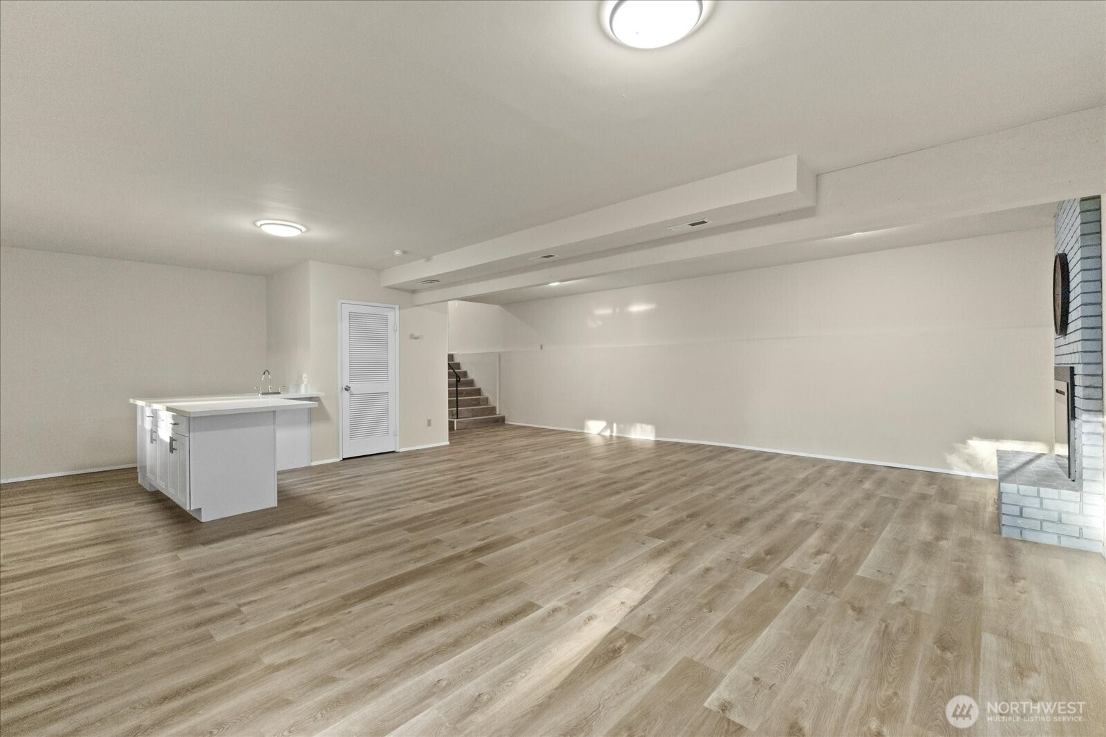 9607 122nd Avenue Southeast Renton, WA 98056 - Photo 17 of 32 a view of an empty room and wooden floor