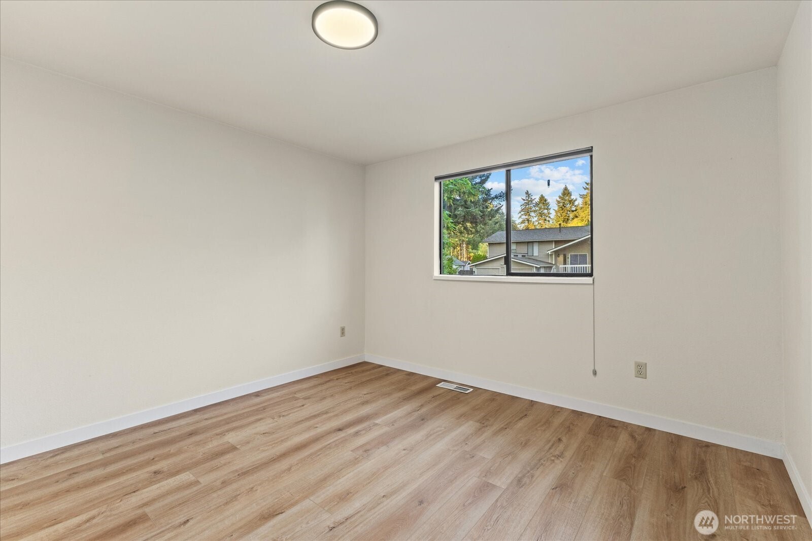 9607 122nd Avenue Southeast Renton, WA 98056 - Photo 21 of 32 a view of empty room with wooden floor