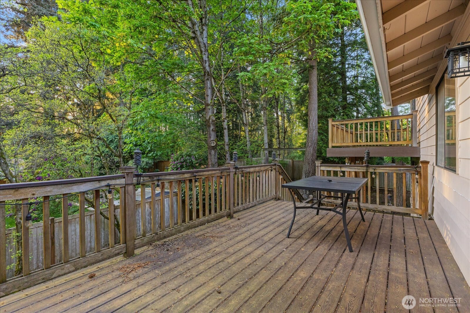 9607 122nd Avenue Southeast Renton, WA 98056 - Photo 28 of 32 a view of a deck with wooden floor and outdoor seating