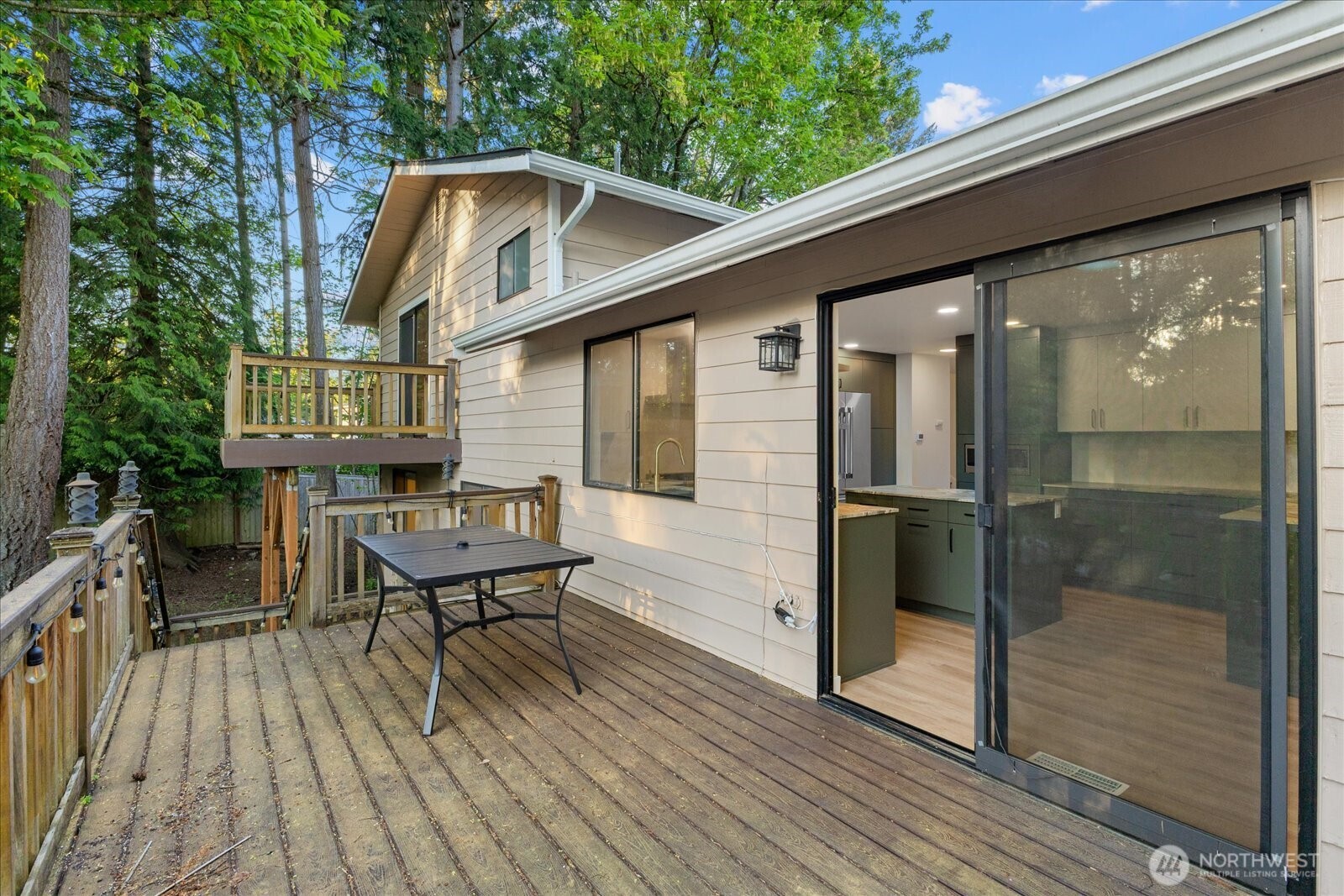 9607 122nd Avenue Southeast Renton, WA 98056 - Photo 29 of 32 a view of a balcony with chairs and wooden floor