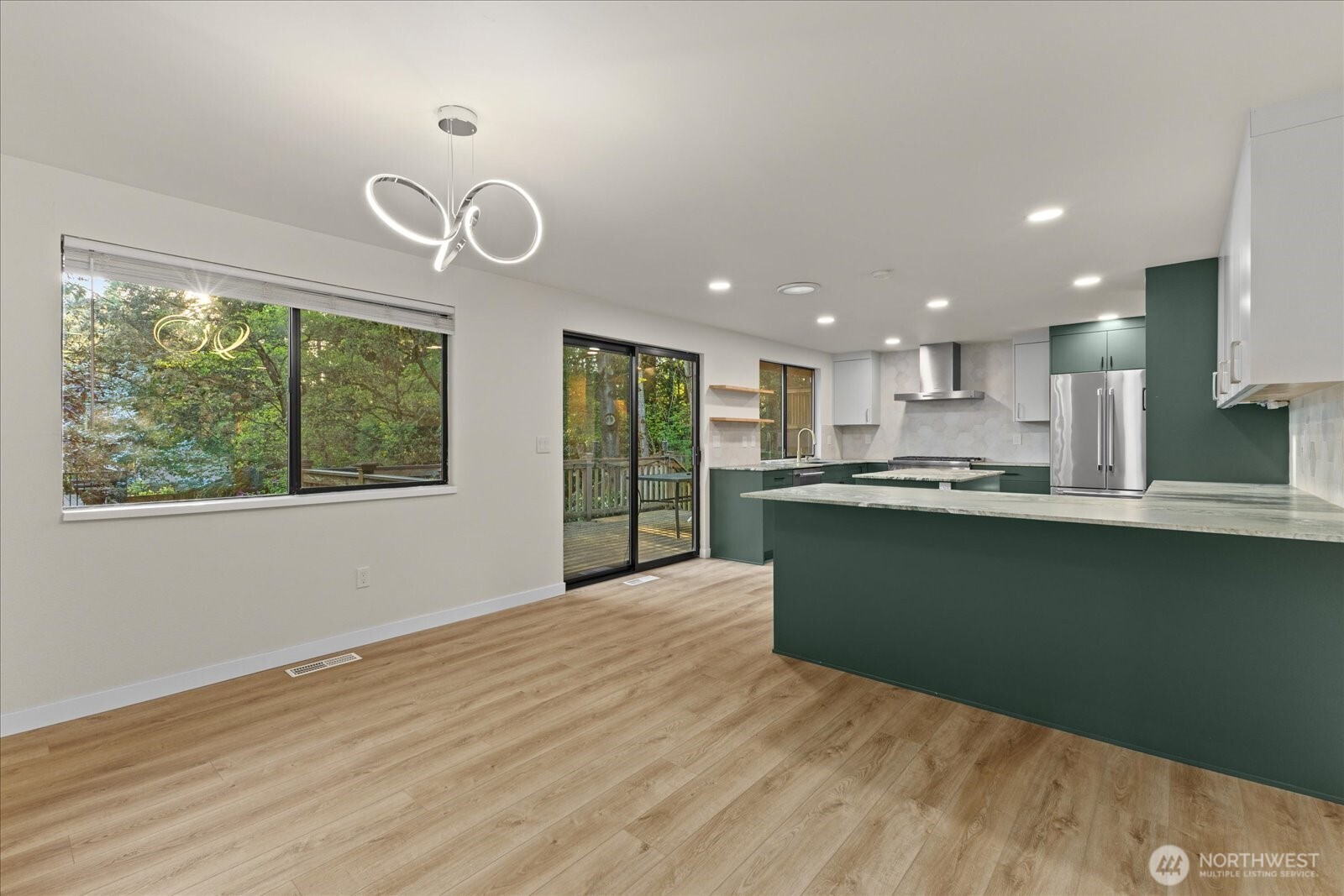 9607 122nd Avenue Southeast Renton, WA 98056 - Photo 8 of 32 a view of kitchen with wooden floor and window