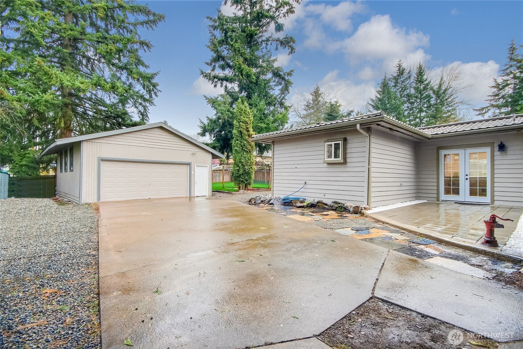 2308 Northeast 27th Street Renton, WA 98056 - Photo 3 of 24 a white house with trees in the background
