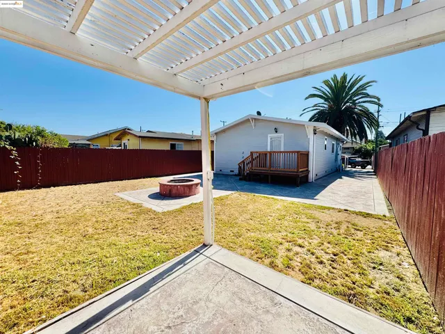 a view of swimming pool with a table and chairs