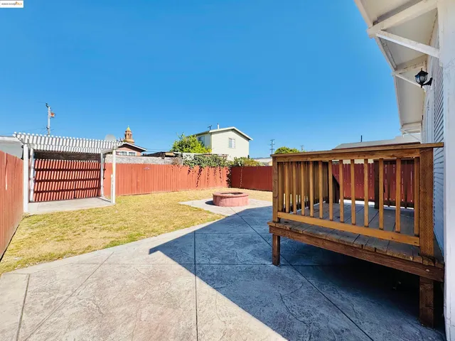 a backyard of a house with yard and outdoor seating