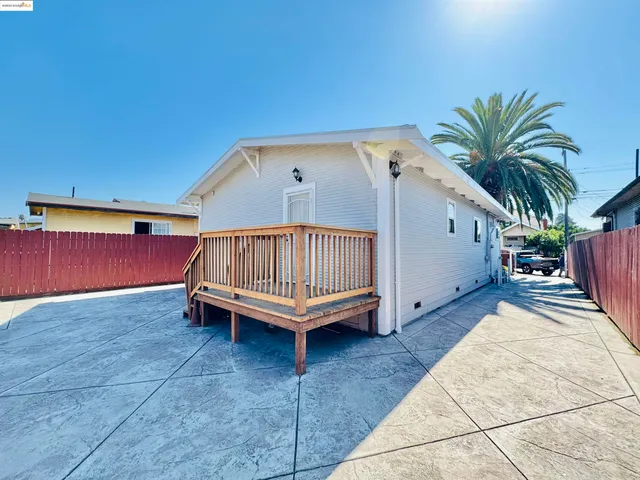 a view of a backyard with a sitting area