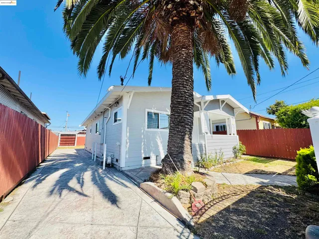 a view of backyard with a patio