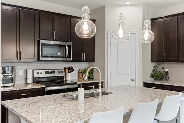 a kitchen with sink and stainless steel appliances
